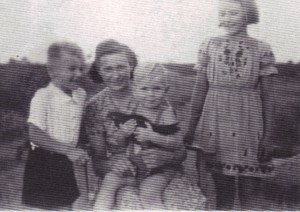 Our Polish maid, Maria, with  the three of us, Summer 1944