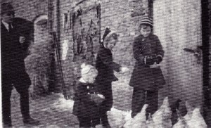 I and my two year old brother with Eva T and her father looking on.