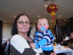 Our daughter Monika has arrived. She is the twins' mum. She proudly holds her little grandson, Lucas.