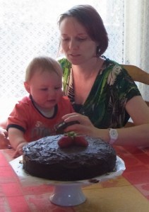 Lucas with Aunt Caroline admires the cake