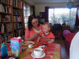 Monika gives her grandson some cake.