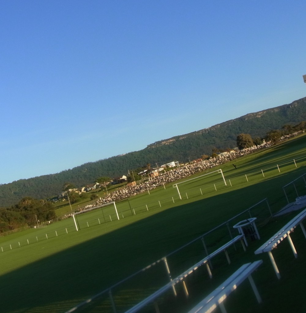 There is a cemetery close to where the beach is with the escarpment in the background.