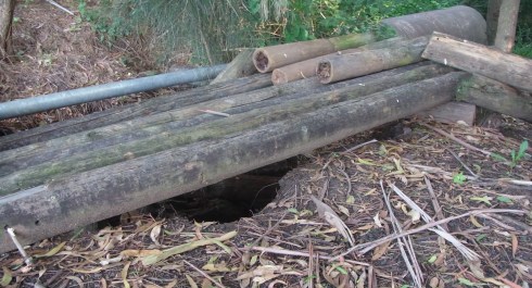 In the past some huge rainfalls must have caused this drainage hole which was then covered somewhat. 