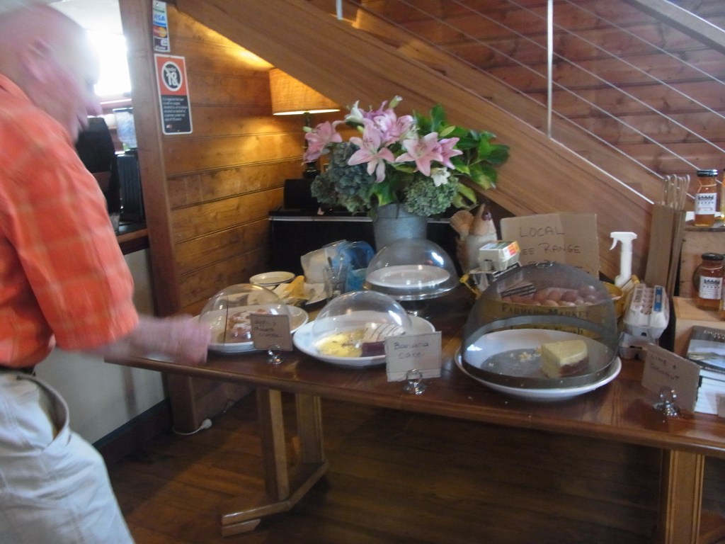 Peter finds a beautiful display of cakes in side and decides to order some rhubarb cake together with the coffee.