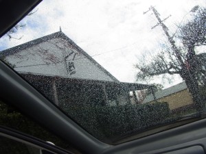 This picture is taken through the wet windscreen of the car.