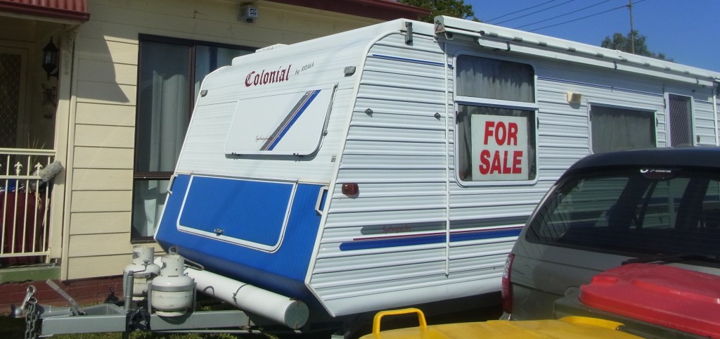 I saw this caravan FOR SALE in front of one house.
