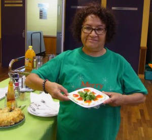 Marta proudly holds up some of the food that she had brought along.