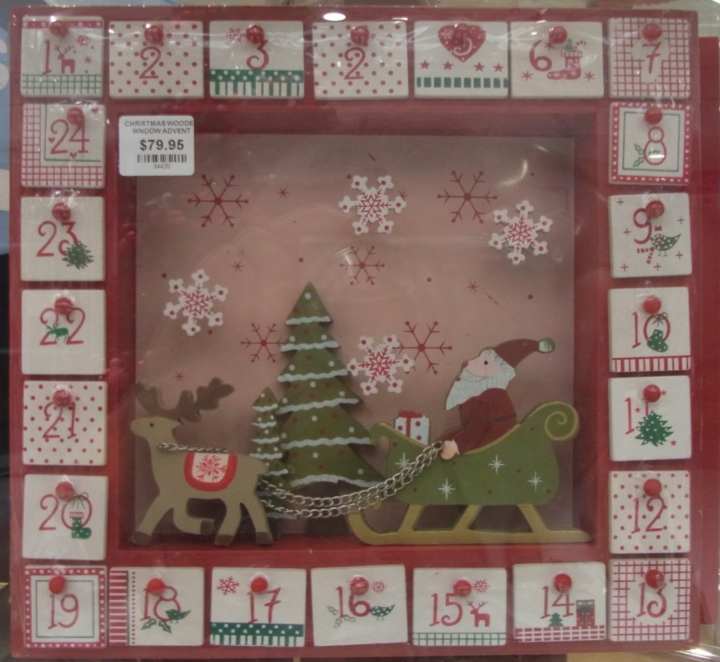 I noticed this wooden Advent calendar in the window.