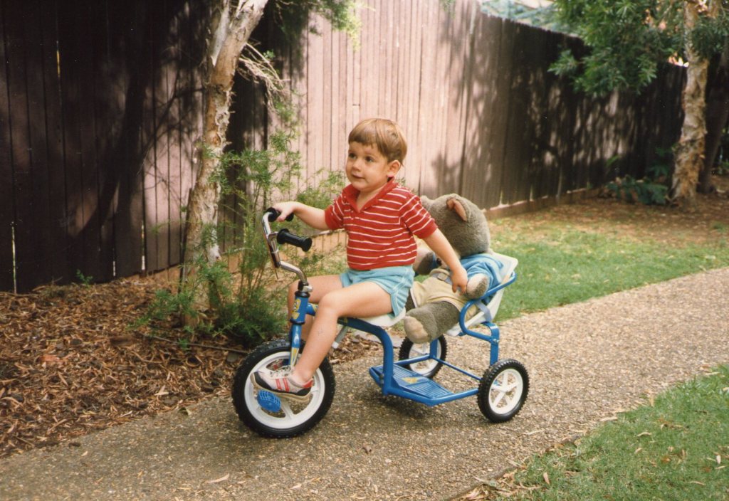 Tristan is two and a half years old riding his bike at Ashfield, Dec. 1987