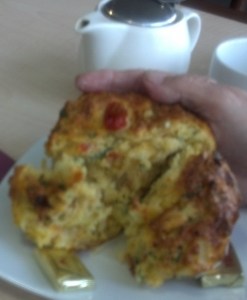 A warm, savoury pumpkin muffin with butter.