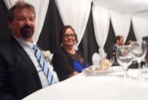 The bridegroom's parents sitting at the front with the newly married couple.