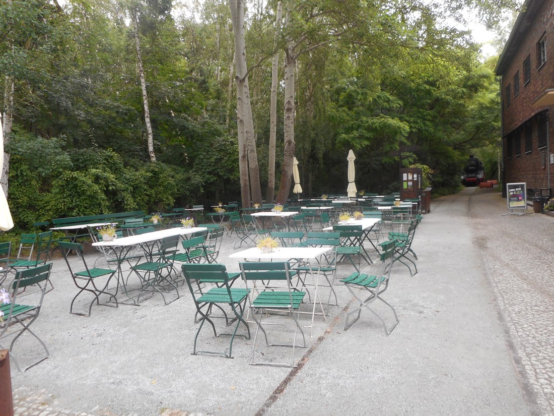 The cafe, that was closed, had a lot of outside seating available. 