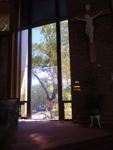 One of the church windows.It was an extremely hot day. Still a lot of people turned up for the Mass.