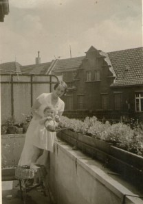 Uta loves to water the plants. Mum is looking on.